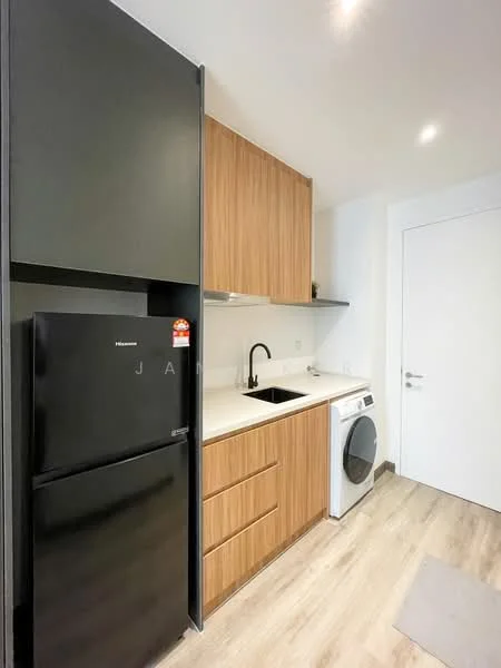 Kitchen features: black refrigerator, black single-bowl stainless-steel sink, chrome pull-down faucet, wood cabinetry, white countertop, built-in washing machine, light wood laminate flooring, white walls, recessed downlights, door leading to another room; style: modern.