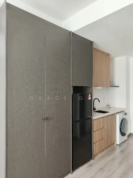 Kitchen features: black fridge, built-in cabinetry with grey finish, wood cabinetry with light finish, single-bowl stainless-steel sink, chrome pull-down faucet, built-in washing machine, countertop, grey laminate flooring; style: modern.