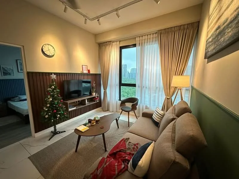 Living features: beige fabric sofa, wooden coffee table, floor-to-ceiling windows, sheer curtains, recessed downlights, decorative wall clock, TV console, wall-mounted TV, area rug, decorative plant, Christmas tree, accent wall with wood paneling, green painted wall; style: modern; view: city.