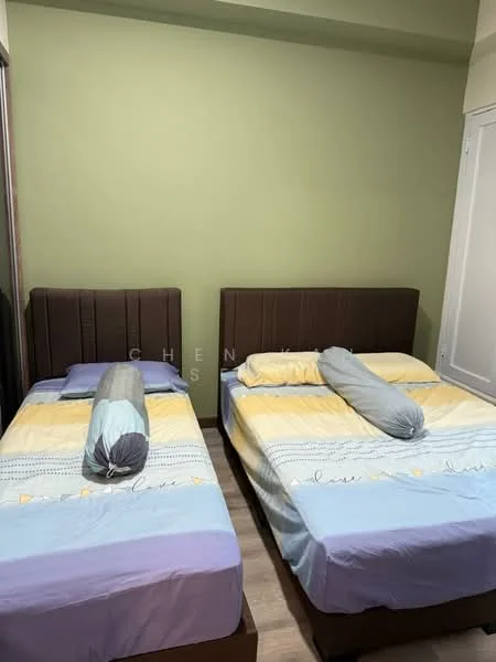 Bedroom features: two single beds with brown upholstered headboards, light blue and yellow bedding, decorative bolster pillows, green accent wall, laminate flooring, built-in wardrobe, window with white frame, neutral-colored curtains; style: modern.