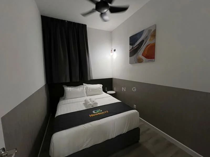 Bedroom features: queen-size bed, white bedding, black bed runner, 2 bedside pillows, wall-mounted light fixture, ceiling fan, grey accent wall, white painted walls, dark curtains, wooden flooring, framed artwork on wall; style: modern.