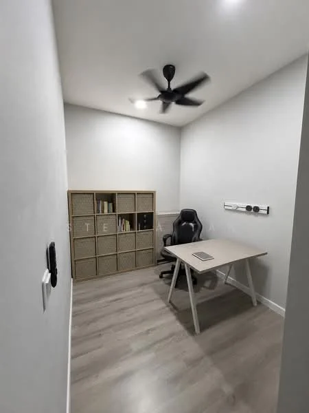 Study features: light wood laminate flooring, white painted walls, ceiling fan, desk with white legs and wooden top, black ergonomic office chair, open shelving unit with woven baskets, wall-mounted power outlet, recessed ceiling lights; style: modern.