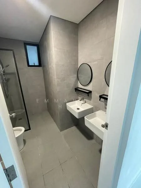 Bathroom features: grey tile flooring, grey wall tiles, two wall-mounted sinks, chrome faucets, two round mirrors, black wall-mounted shelves, toilet, glass shower enclosure, shower head, window for natural light; style: modern.