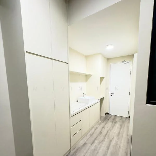 Laundry features: light beige cabinetry, white countertop, single-bowl sink, chrome faucet, built-in storage cabinets, grey laminate flooring, white walls, recessed ceiling lights, door with silver handle; style: modern.