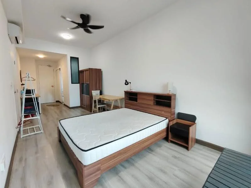 Bedroom features: queen-size bed, wooden bed frame, mattress without bedding, wooden bedside table, desk with chair, built-in wardrobe, ceiling fan, wall-mounted air conditioning unit, light-colored walls, laminate flooring, doorway leading to hallway; style: modern.