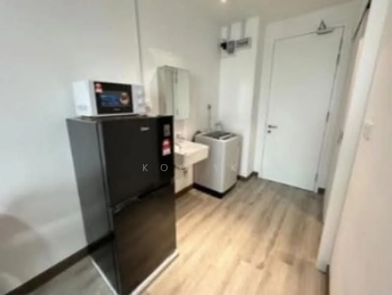 Laundry features: black fridge, built-in microwave, white sink, front-load washing machine, light wood laminate flooring, white painted walls, mirror above sink, door leading to another room; style: modern.