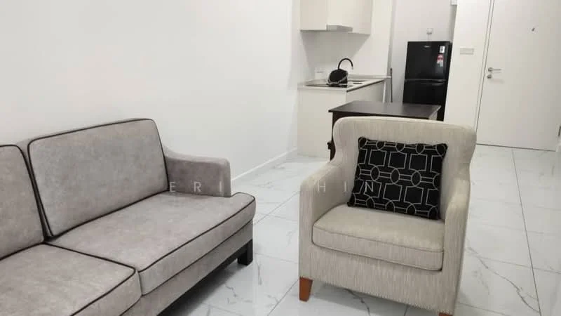 Living features: grey fabric 3-seater sofa, cream upholstered armchair with black geometric pattern cushion, white walls, marble tile flooring, kitchenette with white cabinets, black refrigerator, small dining table, light fixture on ceiling; style: modern.