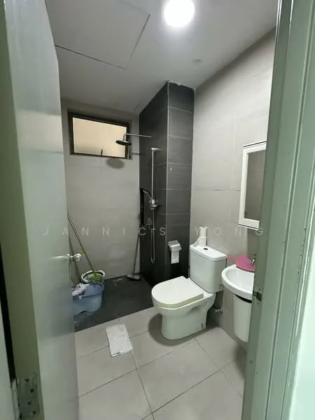 Bathroom features: grey tiled walls, light grey floor tiles, walk-in shower with glass partition, chrome handheld shower head, toilet, sink with mirror, window for natural light, towel rail; style: modern.