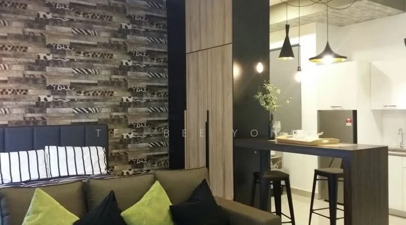 Living features: sofa in grey fabric, black upholstered headboard, striped throw pillows, wood accent wall with patterned design, bar counter with two black stools, pendant lighting above counter, open kitchen area, white cabinetry, stainless-steel sink, grey concrete ceiling; style: modern.