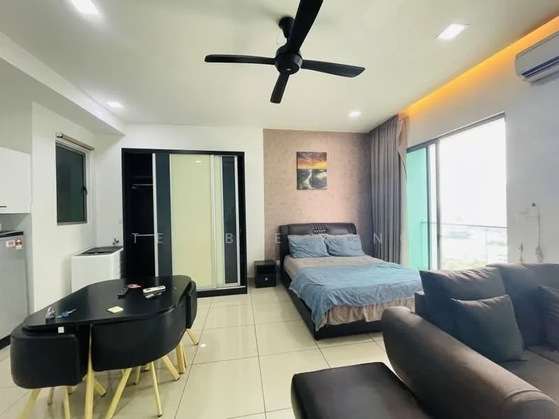 Living features: sofa in dark brown fabric, coffee table, wall-mounted TV, 5-blade ceiling fan with light, large window with city view, tile flooring, decorative artwork on wall, curtains, built-in wardrobe with sliding doors, queen-size bed with blue bedding, nightstand; style: modern; view: city. Kitchen features: white cabinetry, stainless-steel fridge, sink, countertop, open layout; style: modern.