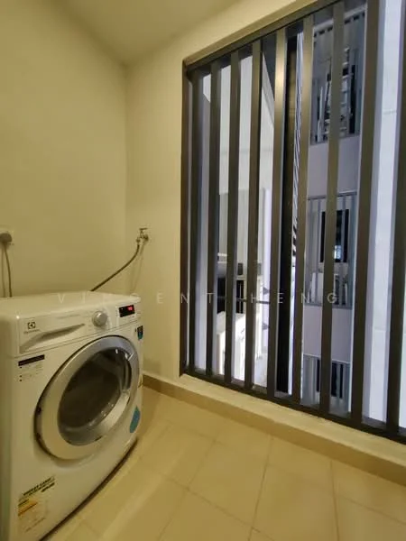 Laundry features: front-load washing machine, grey tiled flooring, white walls, window with vertical metal bars, plumbing connection, natural light from window.