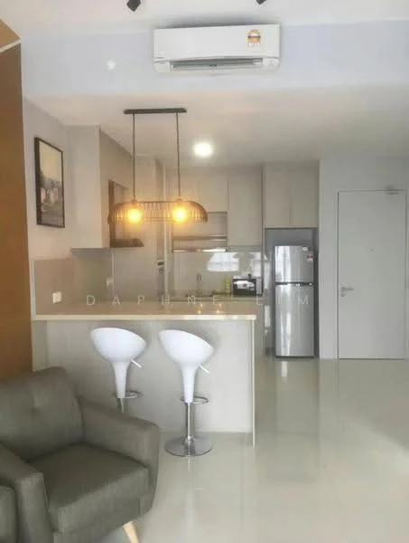 Kitchen features: white cabinets, grey countertop, stainless-steel fridge, built-in oven, 4-burner gas hob, single-bowl stainless-steel sink, chrome pull-down faucet, pendant lighting, recessed downlights, bar stools, open layout, wall-mounted split AC; style: modern. Living features: fabric sofa in green, coffee table, open layout, wall-mounted TV, area rug; style: modern.