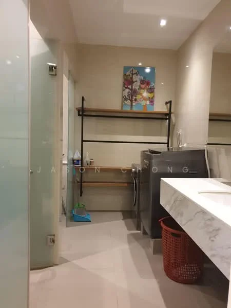 Bathroom features: double-sink vanity with marble top, chrome basin mixer faucets, framed mirror, built-in shelves, washing machine, tile flooring, light-colored wall tiles, glass shower door, laundry basket, cleaning supplies storage, artwork on wall; style: modern.