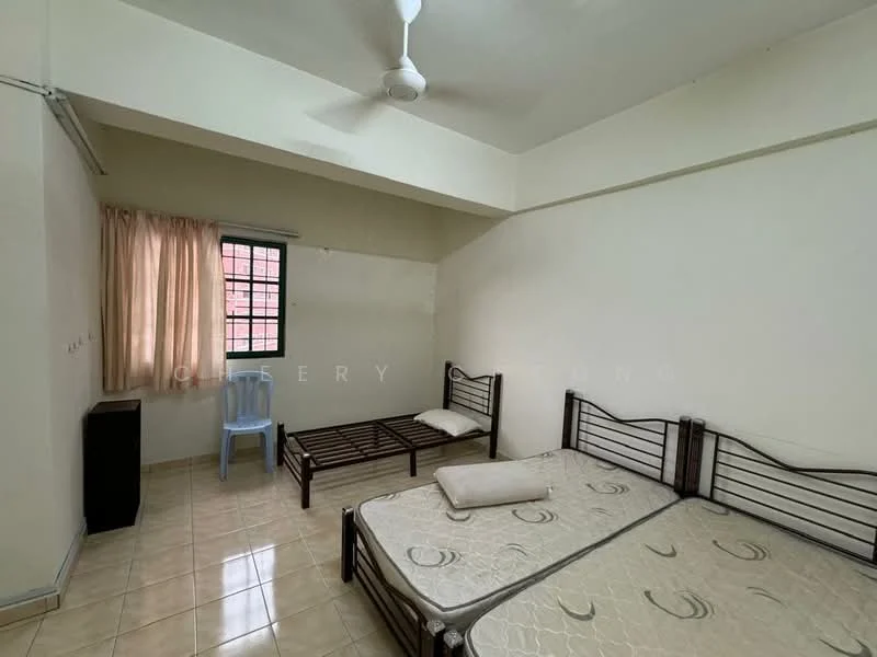 Bedroom features: cream painted walls, tile flooring, single bed frame, double bed frame, mattress on double bed, pillow on double bed, window with sheer curtains, ceiling fan, plastic chair, small black cabinet.