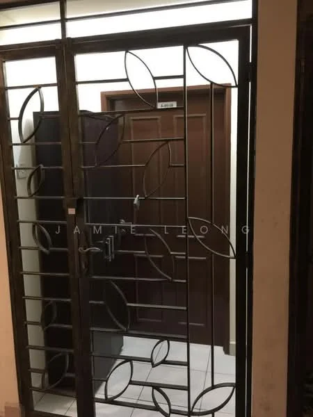 Room features: metal security gate with leaf pattern, brown wooden door, white tiled flooring, wall-mounted light fixture, neutral wall color; style: modern.