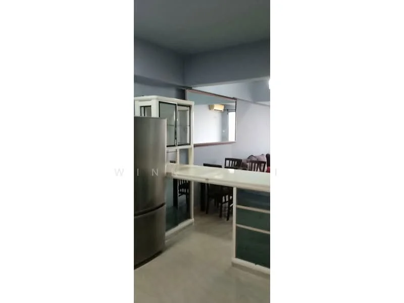 Kitchen features: stainless-steel fridge, white cabinetry, countertop with breakfast bar, open layout, dining table with chairs, window with view, light-colored flooring, grey walls; style: modern.