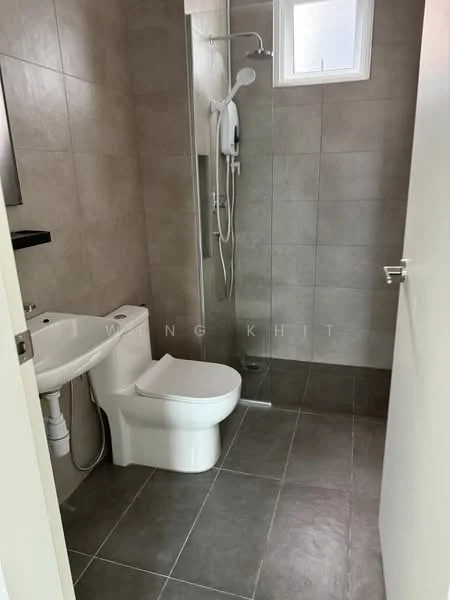 Bathroom features: grey tiled walls, light grey floor tiles, walk-in shower with glass enclosure, shower head, handheld shower, toilet, single-sink vanity, mirror above vanity, window for natural light; style: modern.