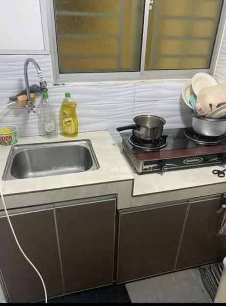 Kitchen features: single-bowl stainless-steel sink, chrome pull-down faucet, white countertop, brown cabinetry, built-in electric stove, stainless-steel pot on stove, various cleaning supplies, dishware in bowl, grey tiled flooring, window with yellow glass; style: modern.