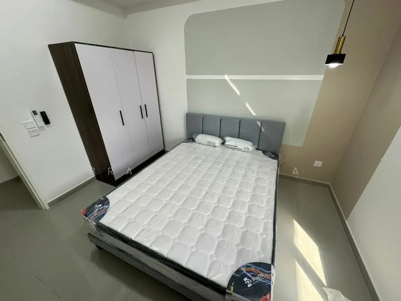 Bedroom features: queen-size bed, upholstered headboard, grey fabric bed frame, white mattress, built-in wardrobe with pink doors, light fixture with black shade, painted accent wall in beige, grey painted walls, flooring in light grey, window with no visible treatment, wall-mounted intercom, decorative pillows; style: modern.