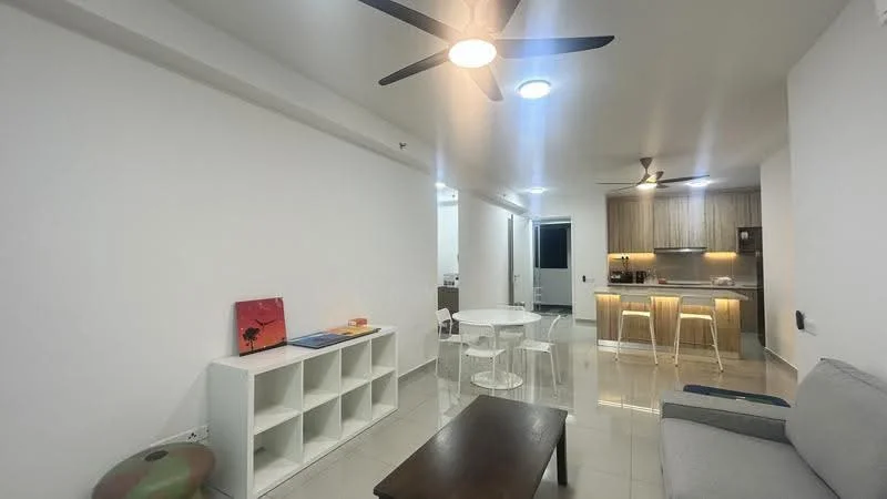Living features: white painted walls, glossy tile flooring, 5-blade ceiling fan with light, sofa in grey, coffee table, dining table with white chairs, open kitchen layout, recessed downlights; style: modern. Kitchen features: wood cabinetry, stainless-steel appliances, kitchen island with seating, recessed lighting; style: modern.