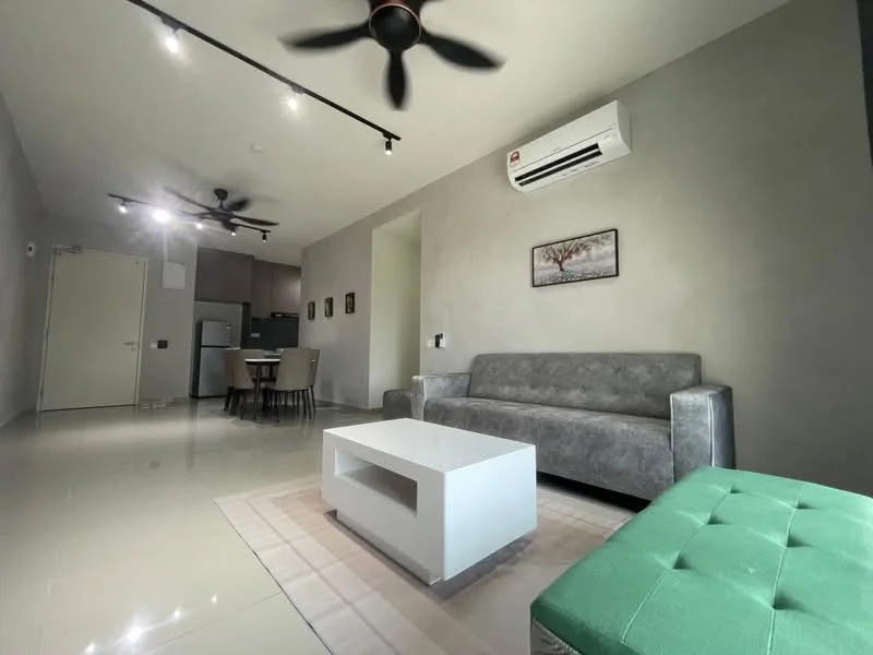 Living features: grey fabric sofa, white coffee table, green ottoman, 5-blade ceiling fan with light, wall-mounted split AC, recessed LED downlights, cream painted walls, glossy tile flooring, dining area with round table and chairs visible in background; style: modern.