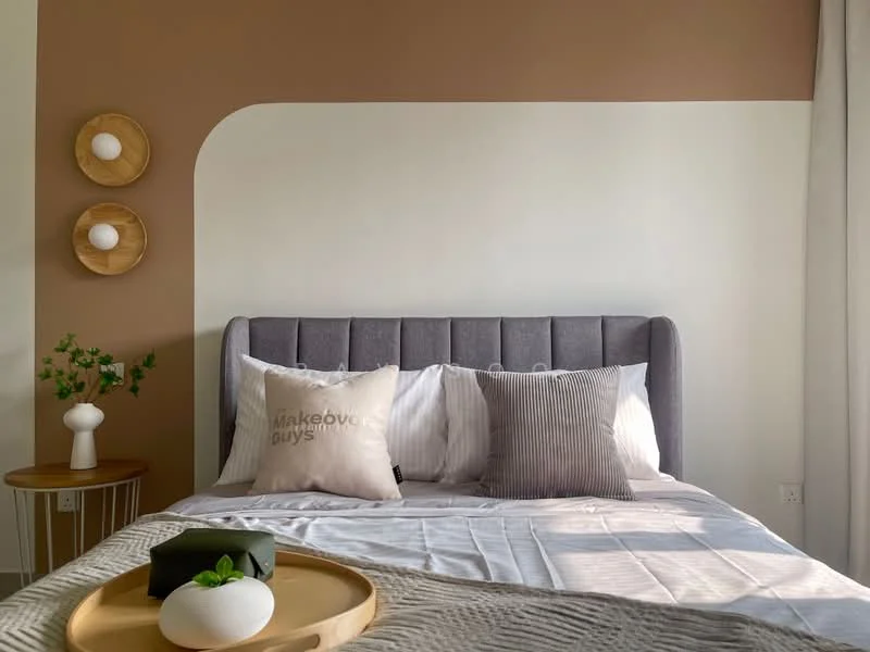 Bedroom features: grey upholstered headboard, queen-size bed, white bedding with striped pillows, decorative throw pillows, wooden bedside table, white ceramic vase with greenery, round wooden tray, beige throw blanket, accent wall in brown, white painted walls, floor-to-ceiling curtains; style: modern.