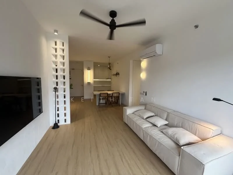 Living features: 3-seater fabric sofa in white, floor-to-ceiling windows, 5-blade ceiling fan with light, wall-mounted TV, light wood flooring, white painted walls, decorative wall with cut-out pattern, air conditioning unit, black floor lamp, dining area visible in background; style: modern.
