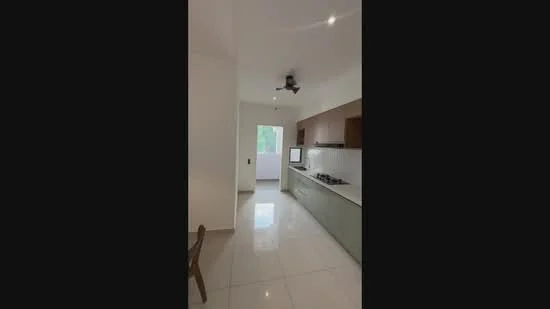 Kitchen features: white painted walls, glossy tile flooring, ceiling fan, kitchen cabinets in wood finish, stainless-steel built-in oven, stainless-steel gas hob, single-bowl stainless-steel sink, white countertop, window with natural light, open layout, dining table, recessed lighting; style: modern; view: garden.