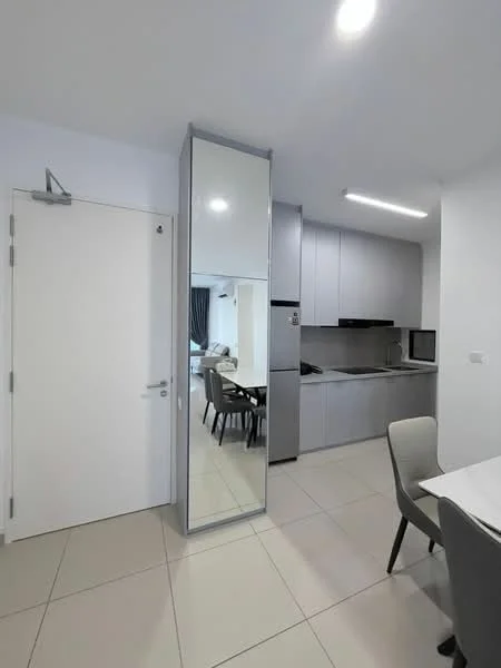 Kitchen features: grey cabinetry, white countertop, built-in oven, microwave, stainless-steel fridge, ceramic tile flooring, recessed LED downlights, mirror panel, dining table with chairs, open layout, wall-mounted cabinets, kitchen sink; style: modern. Room features: white painted walls, door, light fixture.