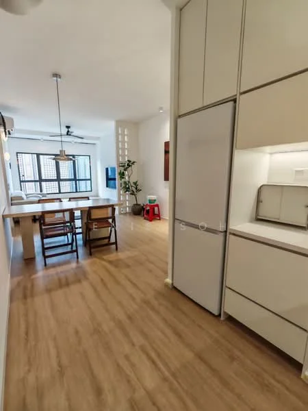 Kitchen features: white cabinetry, built-in refrigerator, light wood flooring, open layout, kitchen island with seating, pendant lighting, stainless-steel appliances, countertop with storage; style: modern. Dining features: wooden dining table, 4 wooden chairs, pendant light above dining table, open space layout; style: modern.