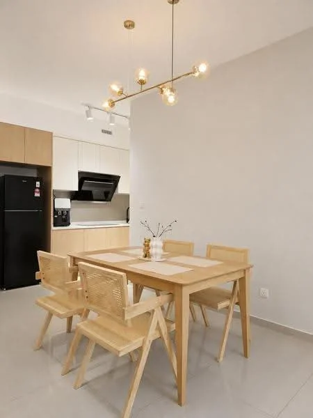 Dining features: wooden dining table, 4 wooden dining chairs, pendant light fixture with multiple bulbs, white walls, grey tile flooring, built-in kitchen cabinetry, black refrigerator, black built-in oven, countertop with integrated sink, open kitchen layout; style: modern.