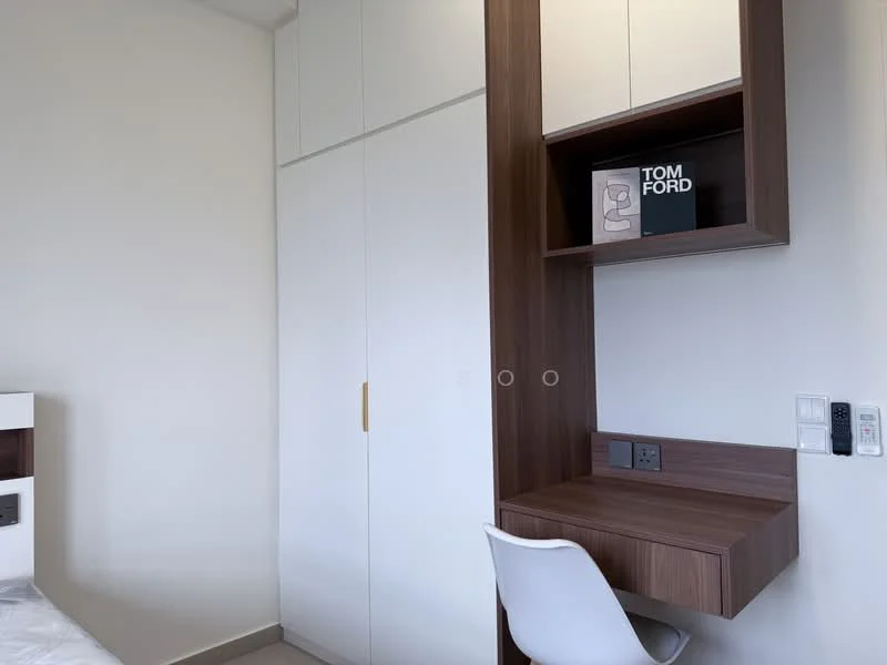 Room features: white painted walls, light grey flooring, built-in wardrobe with white doors, wooden desk with drawer, white chair, shelf with decorative items, power outlets, light switch; style: modern.