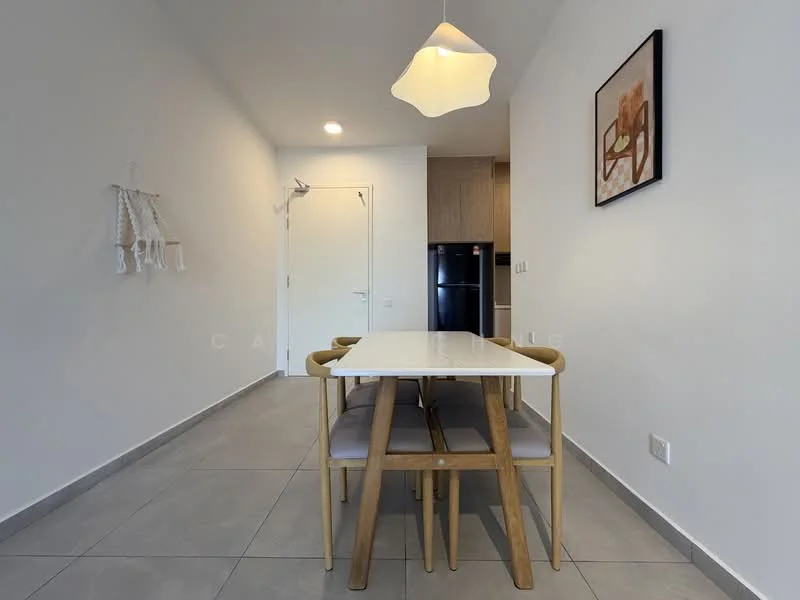 Dining features: white walls, grey tile flooring, 4-seater dining table with wooden legs, upholstered dining chairs in grey, pendant light fixture, framed artwork on wall, refrigerator visible in background, door leading to another room; style: modern.
