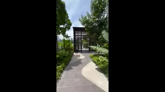 Exterior type: landscape garden; features: stone-paved walkway, manicured lawn, tropical landscaping, mature trees, lush greenery, decorative plants, modern gazebo structure, fenced area, outdoor seating area; style: modern.