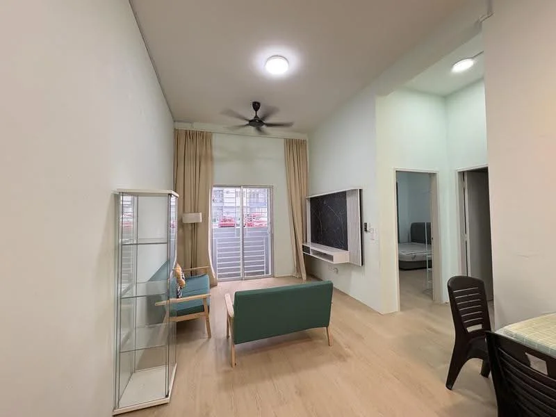 Living features: light wood flooring, white painted walls, 5-blade ceiling fan with light, large window with sheer curtains, green fabric sofa, glass display cabinet, wall-mounted TV console with black accent, dining table with chairs; style: modern. Room features: white painted walls, doorway leading to another room.