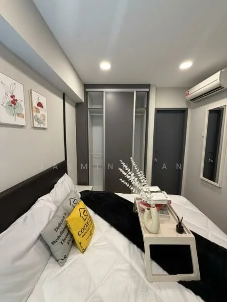 Bedroom features: queen-size bed with white bedding, black throw blanket, decorative pillows with various patterns, nightstand with decorative items, built-in wardrobe with sliding doors, wall-mounted air conditioning unit, recessed ceiling lights, grey accent wall, white painted walls, flooring not visible; style: modern.