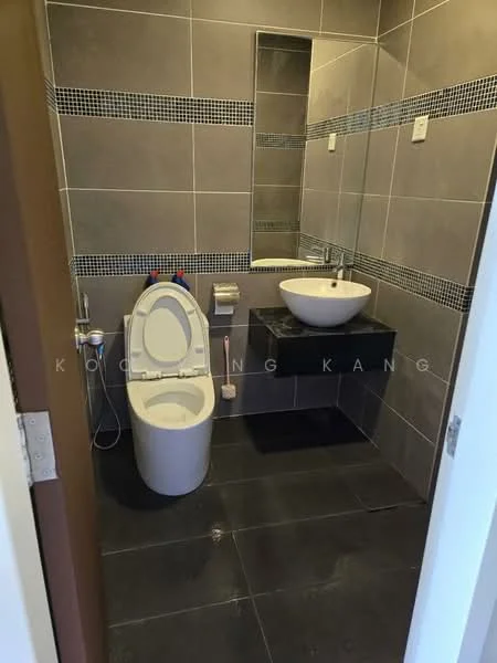 Bathroom features: grey tiled walls, black countertop, round white vessel sink, chrome basin mixer faucet, full-height mirror, one-piece toilet, black tiled flooring, toilet paper holder, towel rack; style: modern.