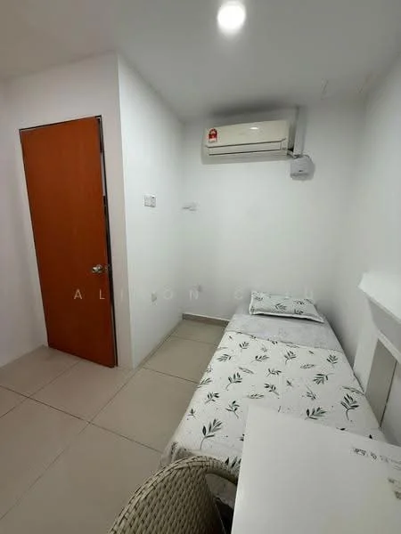 Room features: single bed with floral bedding, white painted walls, tile flooring, wall-mounted air conditioning unit, wooden door, small table, chair; style: modern.