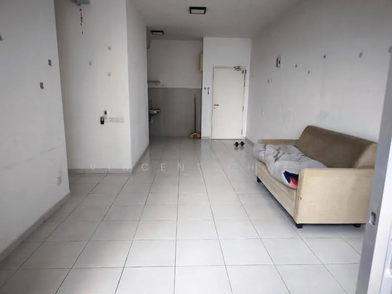Living features: white painted walls, tile flooring, sofa in beige, single door, kitchenette area visible, light fixture on ceiling, no visible decor, no visible appliances.
