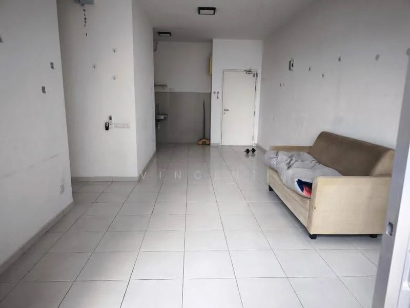 Living features: beige fabric sofa, white walls, tile flooring, recessed ceiling lights, single door, kitchenette area visible, no visible decor, empty space.