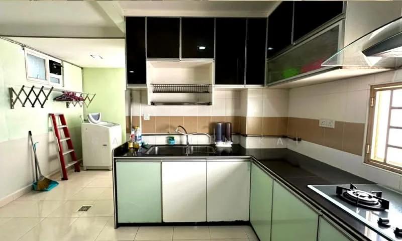 Kitchen features: black granite countertop, green glass-front cabinets, stainless-steel sink, chrome pull-down faucet, built-in gas hob, exhaust hood, white tiled backsplash, ceramic tile flooring, recessed downlights, window with white frame, laundry area with washing machine, ladder against the wall, wall-mounted storage rack; style: modern.