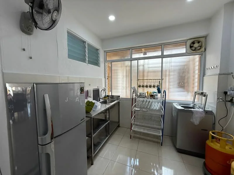 Kitchen features: white painted walls, glossy tile flooring, single-bowl stainless-steel sink, chrome pull-down faucet, stainless-steel fridge, stainless-steel countertop with under-shelf, window with sheer curtains, washing machine, metal drying rack, ceiling fan, wall-mounted air conditioning unit; style: modern.