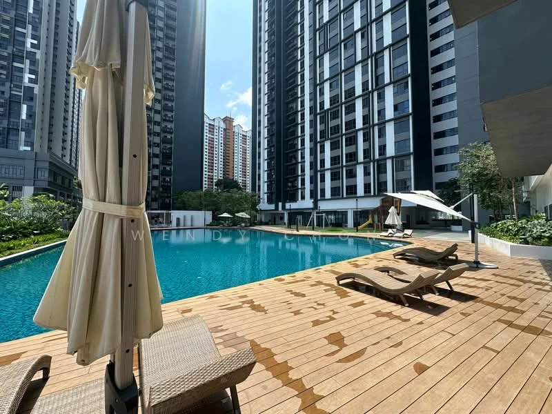 Exterior type: high-rise condominium; features: infinity pool, pool deck with loungers, wooden decking, sun umbrellas, landscaped garden, surrounding high-rise buildings, clear blue sky; style: modern.