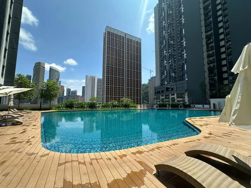 Exterior type: high-rise condominium; features: infinity pool, pool deck with wooden flooring, sun loungers, surrounded by greenery, city skyline in background, high-rise buildings adjacent; style: modern.
