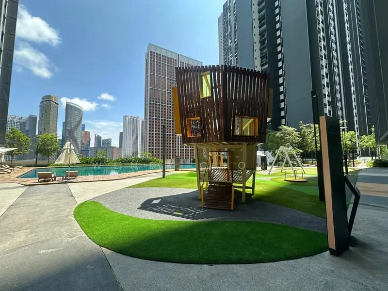 Exterior type: landscape garden; features: playground structure with wooden design, manicured lawn, swimming pool, surrounding high-rise buildings, sun loungers by the pool, shade sail, pathway with grey paving, green grass area, children's swing set; style: modern.