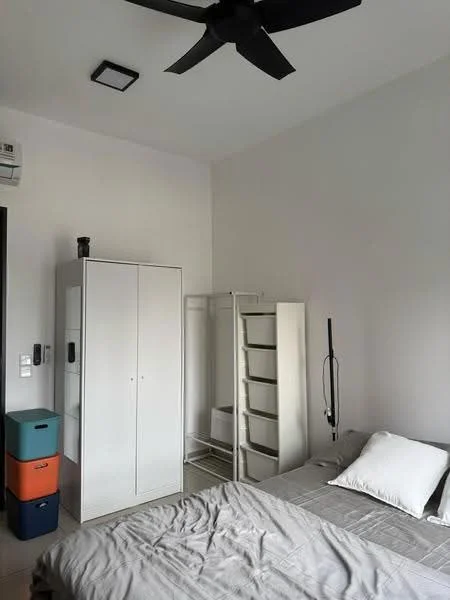 Bedroom features: queen-size bed with grey bedding, white walls, ceiling fan, 1 wall-mounted split AC, white wardrobe with sliding doors, open shelving unit, grey area rug, bedside table, decorative pillow; style: modern.