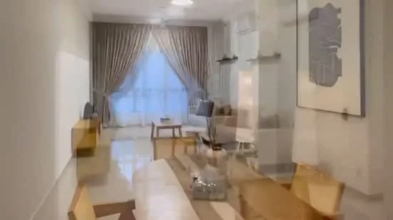 Living features: cream painted walls, white ceiling, large floor-to-ceiling windows, sheer curtains, wooden flooring, sofa in light grey, coffee table, TV console, decorative wall art, shelves on wall, area rug with geometric pattern, recessed downlights; style: modern; view: city.