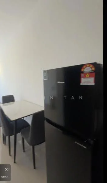 Kitchen features: black fridge, 4-seater dining table, grey upholstered dining chairs, white walls, light-colored flooring, minimalist decor; style: modern.