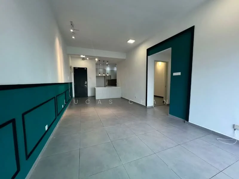 Living features: white painted walls, teal accent wall, grey tile flooring, recessed downlights, open layout, kitchen area visible, doorway leading to another room, no visible furniture; style: modern.
