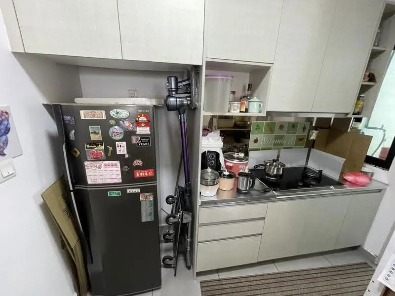 Kitchen features: grey cabinetry, stainless-steel fridge with stickers, built-in stove, metal cooking pots, plastic containers, kitchen utensils, grey countertop, tile flooring, wall-mounted storage, open shelving, dish rack; style: modern.